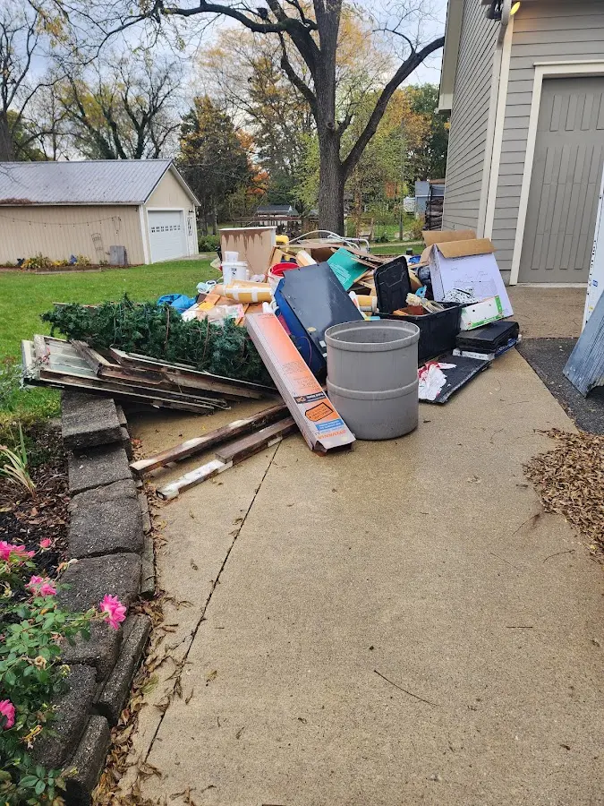 Dumpster being loaded with debris for Estate Cleanout Dumpster Rental in Summerville